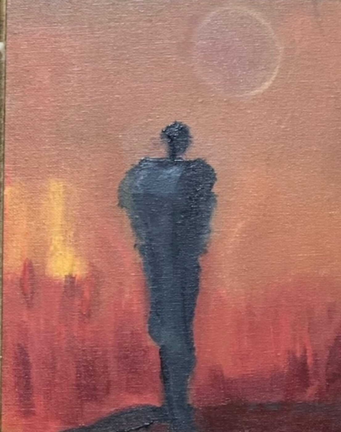 Painting of a solitary slate figure standing before a red and orange horizon under a pale sun, titled The Hunt