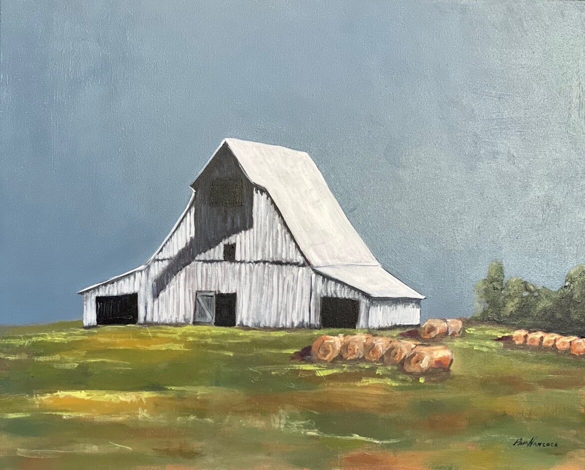 Painting of a white barn with a broad pale roof standing on a green and ochre field, round hay bales scattered behind it under a slate blue sky, titled Country Summer